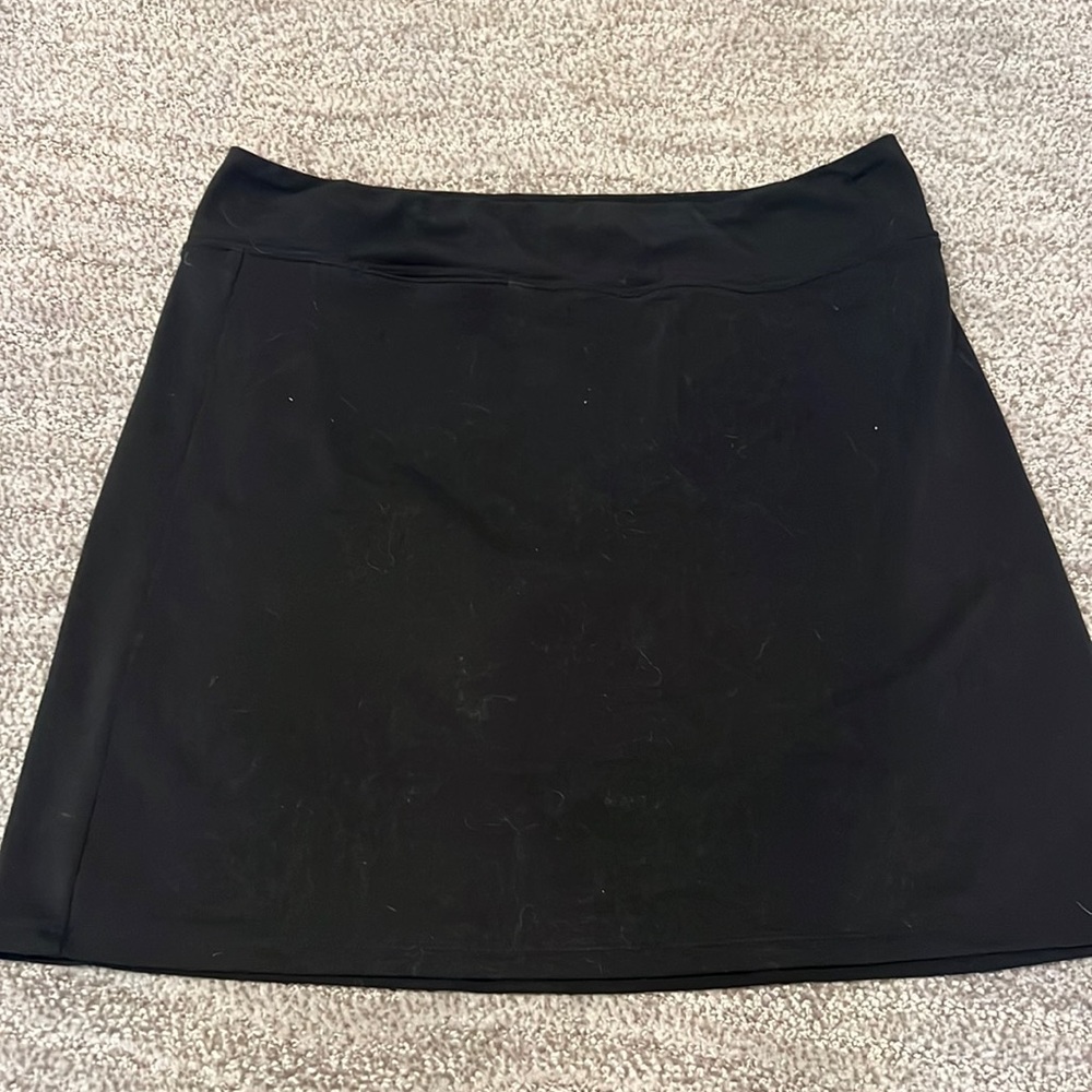 Golf skirt. Adidas Climalite. Black. Attached shorts.Excellent condition.Size 4